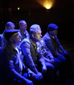 Cast of The Shawshank Redemption in a blue-lit night scene